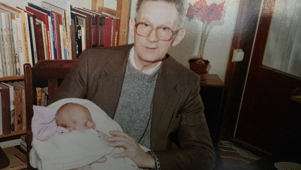 My father holding my daughter