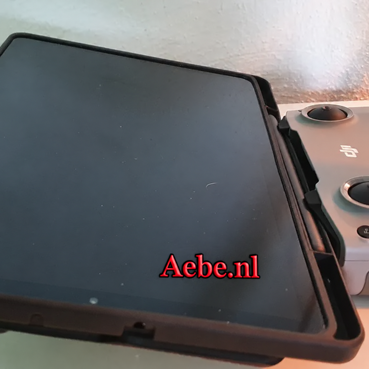 3D-printed tablet holder extender on DJI Mavic Air 2 controller with tablet