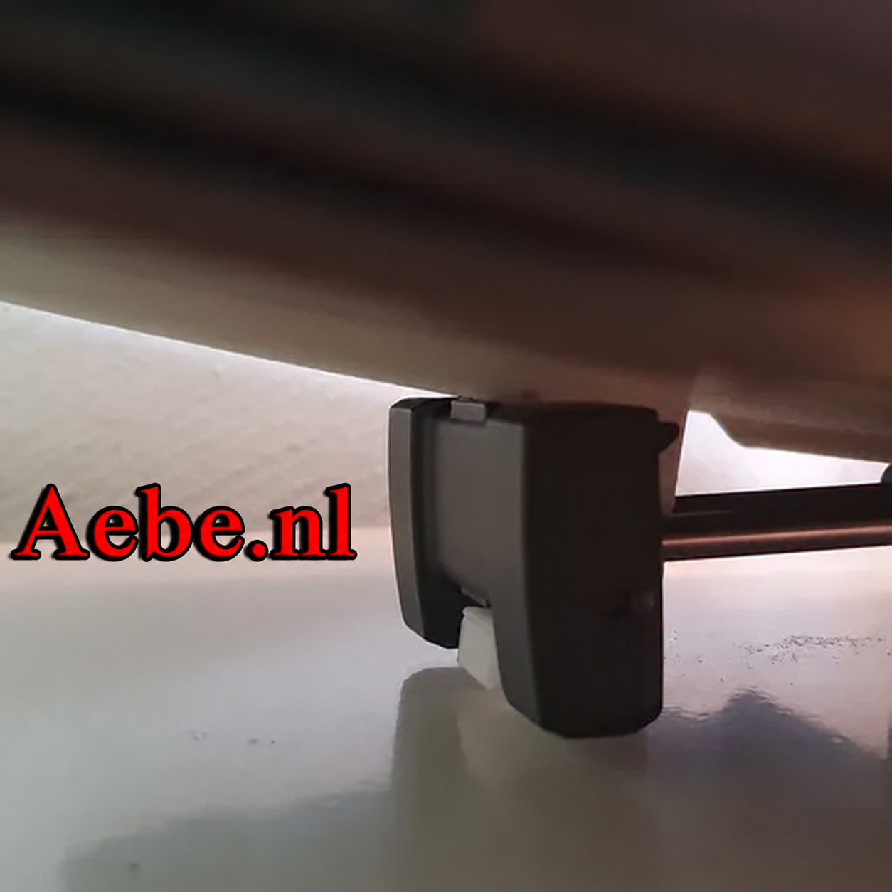 3D-printed extender seen from below, holding the tablet on the DJI Mavic Air 2 controller
